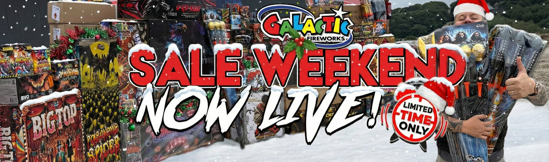 Galactic Fireworks December Sale Weekend web banner. Features a festive scene with snow and a team member in a Santa hat holding a large pack of Musketeer rockets. Surrounded by premium fireworks like 'Big Top' and 'Poisonous Spider' compounds. Text reads 'Sale Weekend Now Live', promoting huge discounts for New Year's Eve 2025 firework displays.