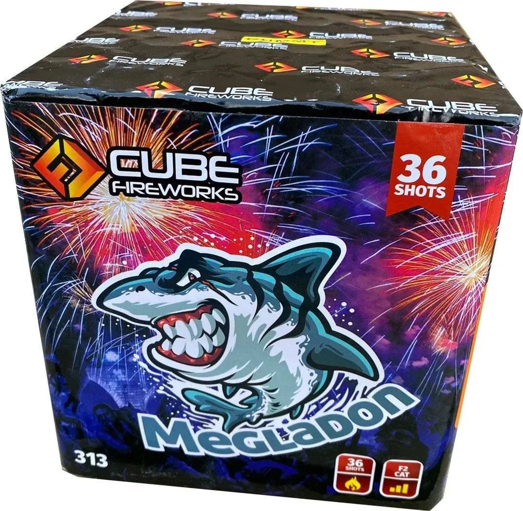 Megladon 36-shot cake by Cube Fireworks in a colorful box featuring a cartoon shark and vibrant firework graphics, ideal for party displays.