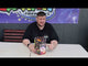 a man sitting at a table with a box of fireworks