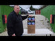 a man pointing at a box of fireworks