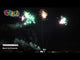 Thunderball firework displaying W-shaped fanned volleys of red and green strobe.
