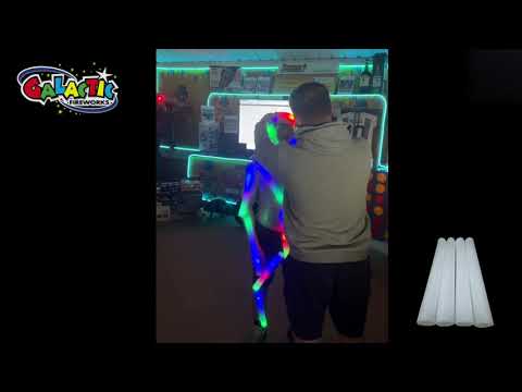 a man dancing in a neon light display