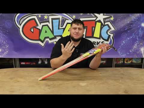 Galactic Fireworks team member holding the Pioneer rocket pack and reviewing the contents.
