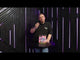 Galactic Fireworks team member holding the Pink Mojo cake and discussing the effects.