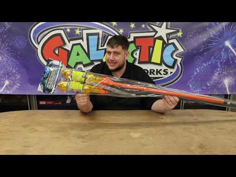Todd Whitley holding Rocking Robots 1.3G rockets pack for size comparison and review.