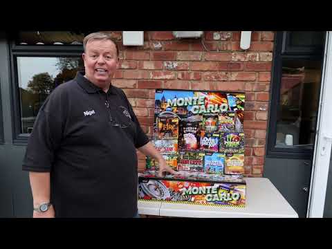 Galactic Fireworks team member unpacking the Monte Carlo box and showing the 11 cakes.