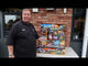 Galactic Fireworks team member unpacking the Monte Carlo box and showing the 11 cakes.