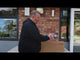 a man is stood in front of a packet of rockets which are on a table