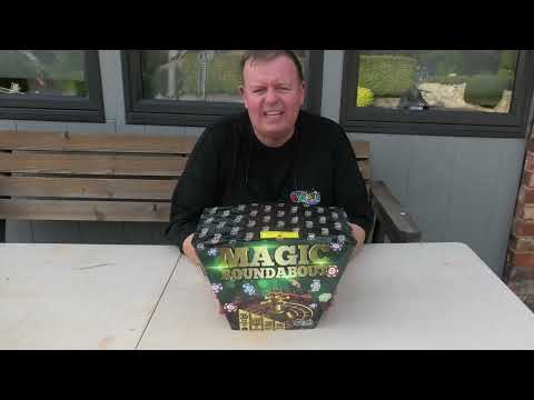 Galactic Fireworks team member introducing the Magic Roundabout cake and demonstrating its fanned shape.