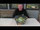Galactic Fireworks team member introducing the Magic Roundabout cake and demonstrating its fanned shape.