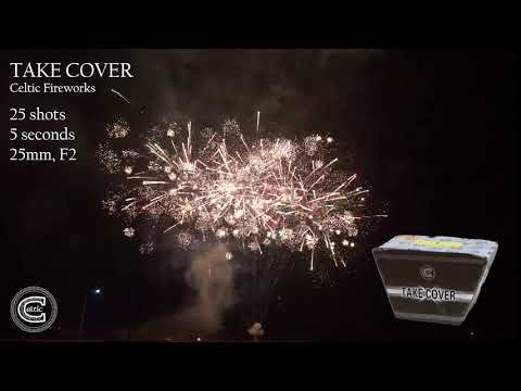 Take Cover firework exploding in a wide fanned volley of crackling palms.