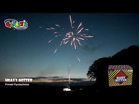 Heavy Hitter Cake by Primed Pyrotechnics in action at dusk, showcasing vibrant aerial bursts from Galactic Fireworks' top-selling firework cake.