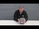 Man presenting the Megladon 36-shot cake by Cube Fireworks, showcasing the product's size and packaging for party and celebration use.