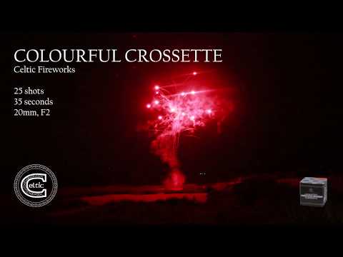 Red crossette burst from Colourful Crossette low-noise 25-shot firework by Celtic Fireworks, captured mid-display against a night sky.