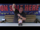 Man presenting Praise The Sky by Brothers Pyrotechnics low noise cake at a fireworks store, highlighting its party-friendly features.