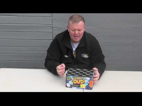 Presenter showcasing the Love It Loud Cake by Galactic Fireworks, a 70-shot high-noise firework ideal for party and celebration events.
