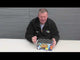 Presenter showcasing the Love It Loud Cake by Galactic Fireworks, a 70-shot high-noise firework ideal for party and celebration events.