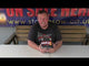 a man sitting at a table with a firework in front of him