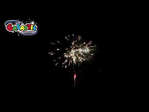 Slammer firework cake in action, displaying vivid red and white strobing bursts in the night sky, ideal for garden or event celebrations.