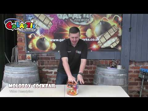 Presenter showcasing Molotov Cocktail firework by Klasek on a table, highlighting its size and packaging for party and celebration use.