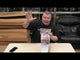 Man presenting Thunder Rockets 6 pack, emphasizing loud titanium salute fireworks for party and celebration use.