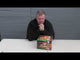 Man presenting the Air Alert Cake by Black Panther, a 70-shot firework cake ideal for parties and celebration events.