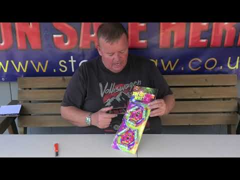 Presenter showcasing Tri Colour Wheels | Twin Pack Spinning Wheels by Bright Star, highlighting features for garden fireworks demonstrations.