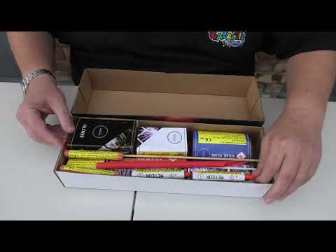 Unboxing Pluto Box low-noise fireworks set showing compact arrangement of 10 colorful fireworks designed for quiet garden celebrations.