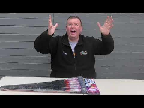 Presenter showcasing Big Bang Rockets by Evolution Fireworks 6-pack, emphasizing their size and explosive celebration potential.