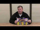 Man holding Galactic Battle firework cake pack by Bright Star, showcasing 5 vibrant 18-shot fireworks ideal for garden parties and festive events.