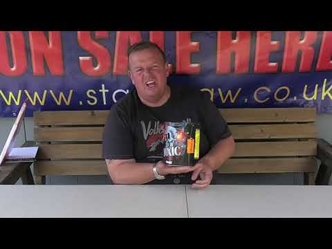 Presenter showcasing the Toxic Cake by Brothers Pyrotechnics, a 19-shot firework with vivid effects, perfect for party and celebration supplies.