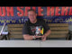 Presenter showcasing the Toxic Cake by Brothers Pyrotechnics, a 19-shot firework with vivid effects, perfect for party and celebration supplies.