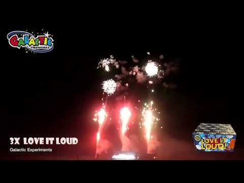 Three Love It Loud Cakes by Galactic Fireworks firing simultaneously, creating a powerful display of red and white bursts in the night sky.