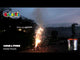 Lunar + FREE Storm fountain fireworks in action, emitting bright sparks in a garden setting, ideal for low-noise backyard celebrations.